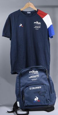 a backpack and a t - shirt hanging on a hanger
