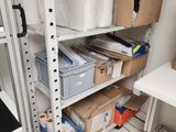 a room with a lot of boxes and boxes on the shelves