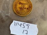 un petit bout de papier sur lequel est représentée une pièce d'or
