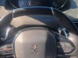 the dashboard of a car with a steering wheel and steering controls