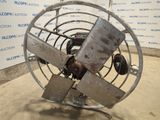 an old fan that is sitting in a room