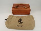 a brown bag with a horse on it and a brown bag with a horse on it