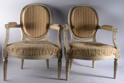 pair of antique chairs with upholstered back and arms