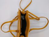 a close up of a purse with a strap on it