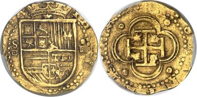 a close up of two gold coins on a white surface