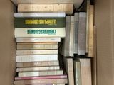 a box full of books sitting on the floor