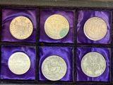 an image of a display case filled with lots of different types of coins