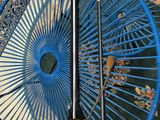 a blue chair with a broom and a broom on top of it