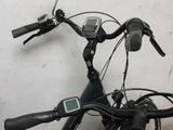 a bicycle that is parked next to a wall