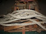 a pile of rope sitting on top of a wooden crate