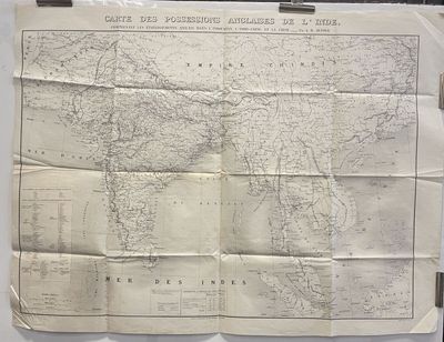 an old map of the world is hanging on a wall