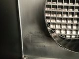 a close up of a machine with a metal grill on it