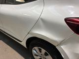 a white car that is parked in a parking lot