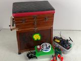 a small chest with tools and a box on the floor