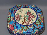 a blue box with a floral design on it