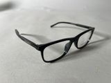 a pair of glasses sitting on a white surface