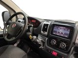 the interior of a car with a steering wheel and dashboard controls