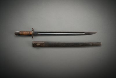 two knives that are laying on a table
