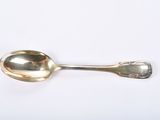 silver plated spoon on white surface with a spoon in the middle