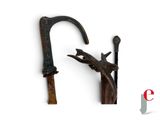 an image of a pair of old canes on a white background