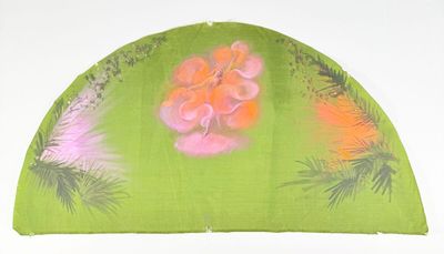 a green fan with pink flowers and pine trees on it