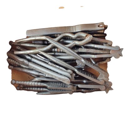 a box full of screws and hammers on a table