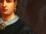 portrait of a woman in a black dress with a necklace and earrings
