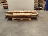 a pallet of wood on the floor in a warehouse