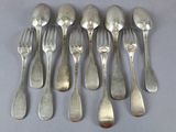 six forks and six spoons are arranged in a row on a table