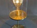 an image of a table lamp with a glass dome on it
