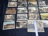 a lot of old postcards sitting on a table