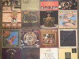 a lot of cds on the floor with pictures on them