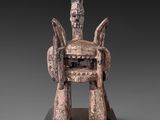an image of a statue of a person sitting on top of a table