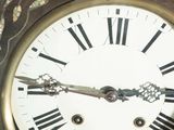 a close up of a clock with roman numerals on it