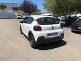 a white car that is parked in a parking lot