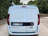 a white van that is parked on the side of the road