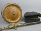 a small wooden object with a knife and a box on the table