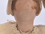 a doll that has a hat on it ' s head
