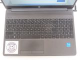 a laptop with a sticker on it sitting on a table