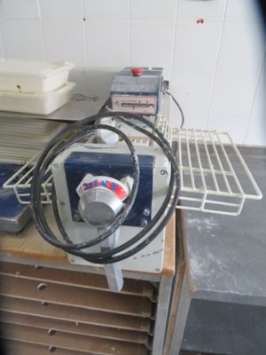 a machine that is sitting on a table in a kitchen