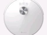 a close up of a robot vacuum cleaner on a white surface