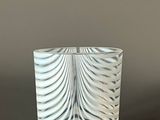 a close up of a glass cup on a table