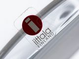 a close up of a glass of water with a red sticker on it
