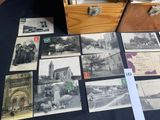 many old photos of people and buildings on the table