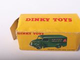 a small box with a toy truck inside of it