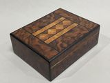 a small wooden box with a wooden inlay on the inside
