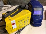 a blue and yellow welder sitting on a table
