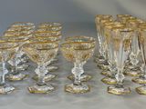a lot of glasses that are sitting on a table
