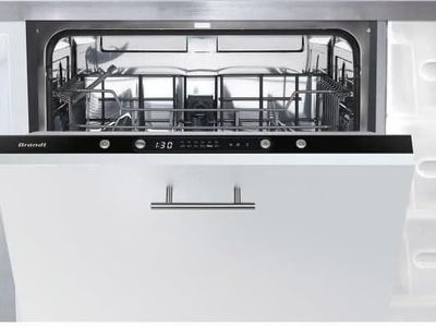 a close up of a dishwasher in a white kitchen