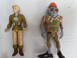 two action figures that are standing next to each other